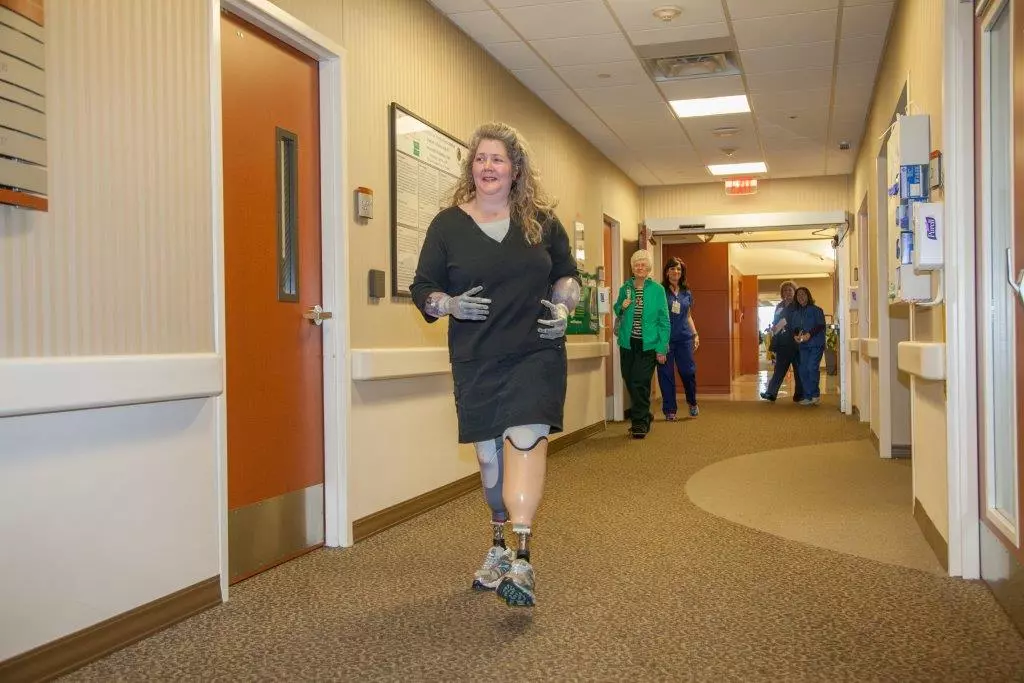Kathryn Kuehn walks through hallway at Baylor Plano.