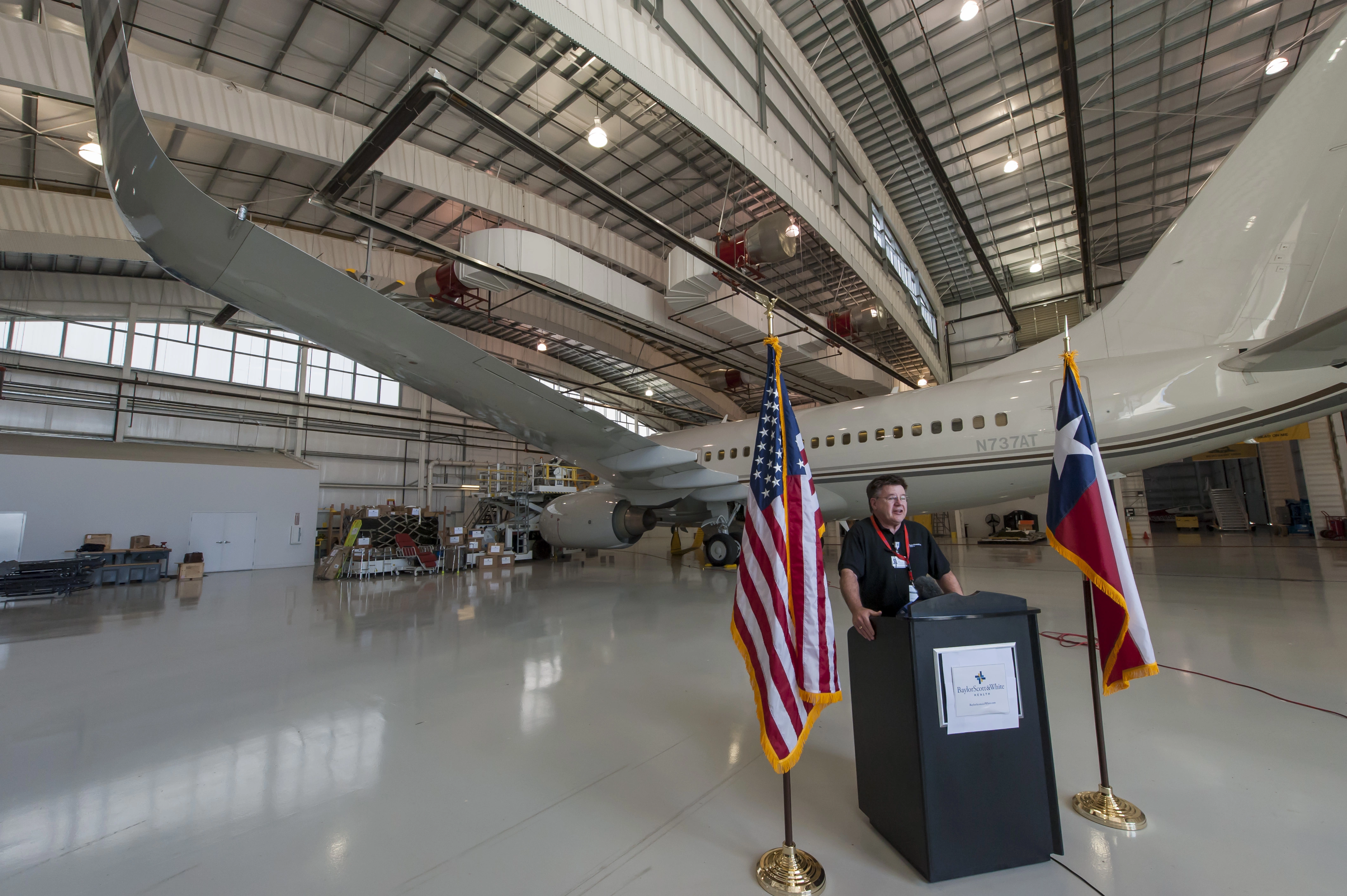 Don Sewell, director of Baylor Scott & White Health's Faith in Action Initiatives, speaks at Fort Worth Alliance Airport on philanthropic effort to aid Syrian refugees.