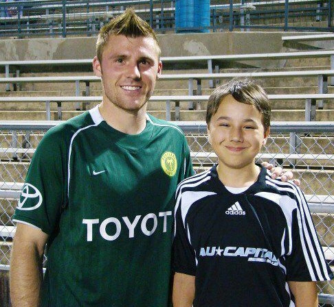 Daniel Mundine photographed with one of his favorite soccer players