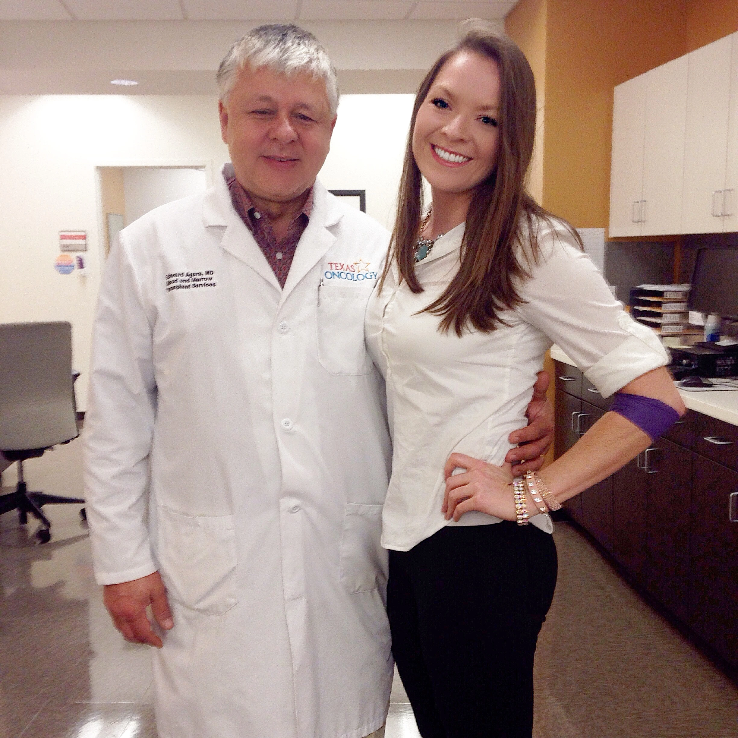 Dr. Edward Agura smiles next to his patient, Candice Stinnett.