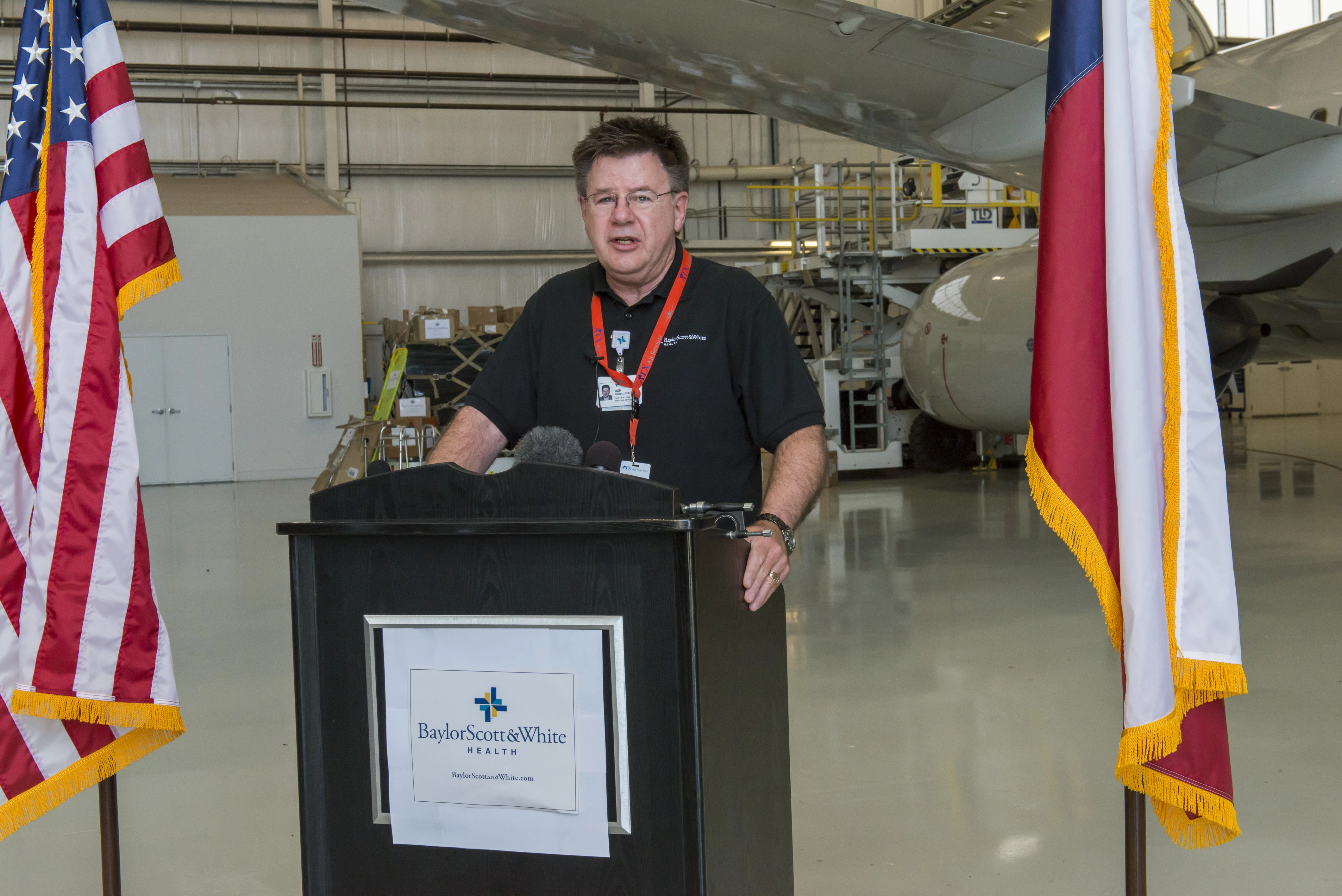 Don Sewell, director of Baylor Scott & White Health's Faith in Action Initiatives, speaks at Fort Worth Alliance Airport on philanthropic effort to aid Syrian refugees.